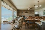 The open concept living areas with wall to wall windows showcase the endless views